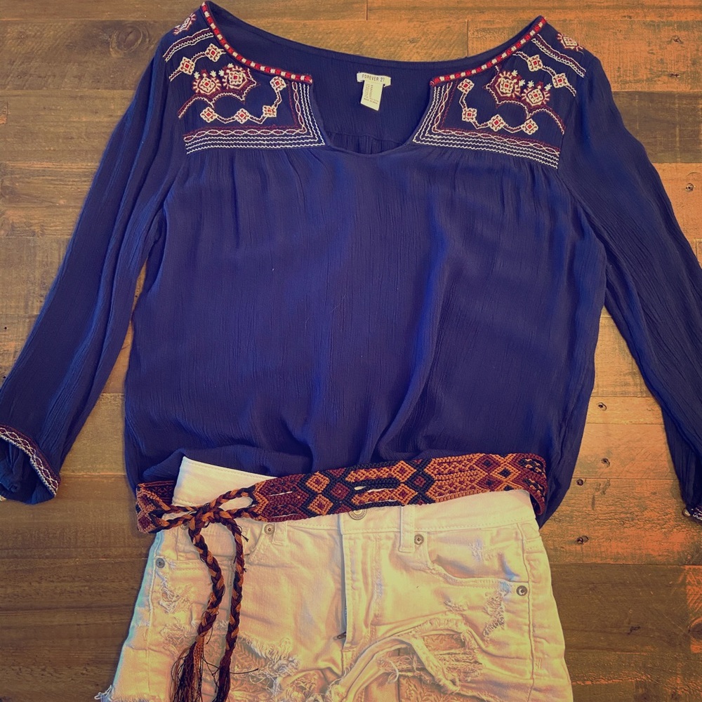 Dark blue blouse with pattern.